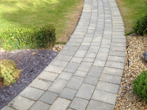 Curved brick paving path